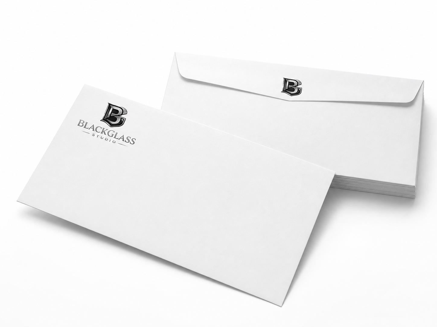 White business envelopes branded with the Black Glass Studio logo